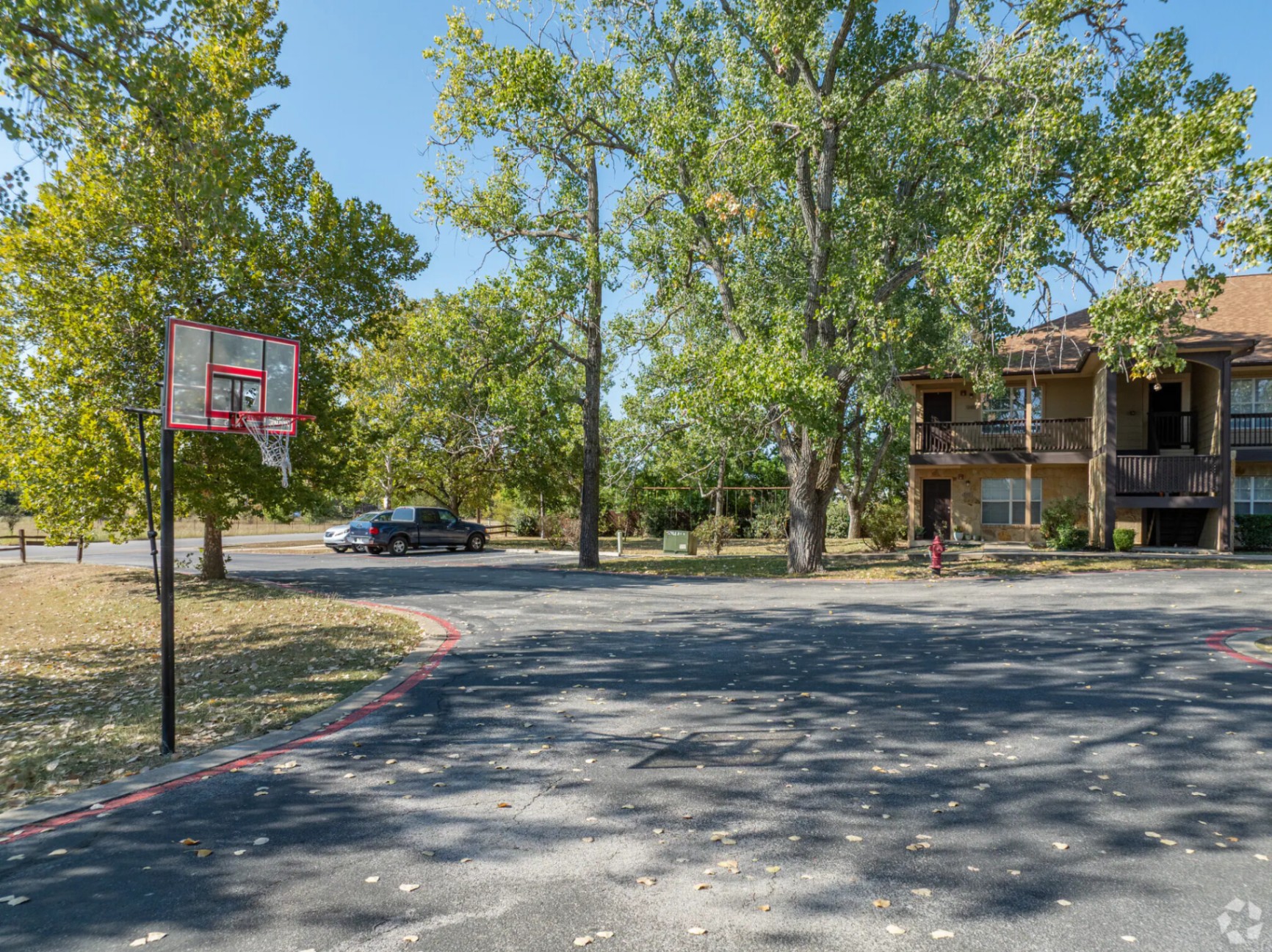 Community basketball hoop near the front parking loop