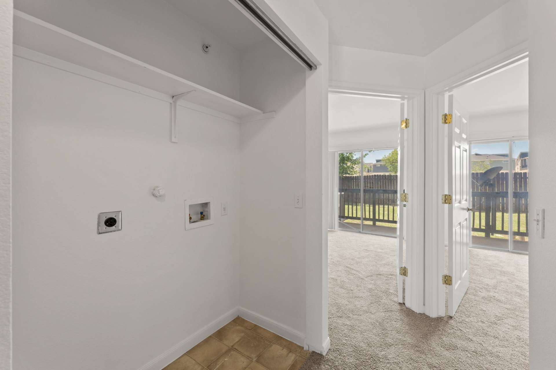 In-unit washer and dryer hookup closet in a classic-finish home