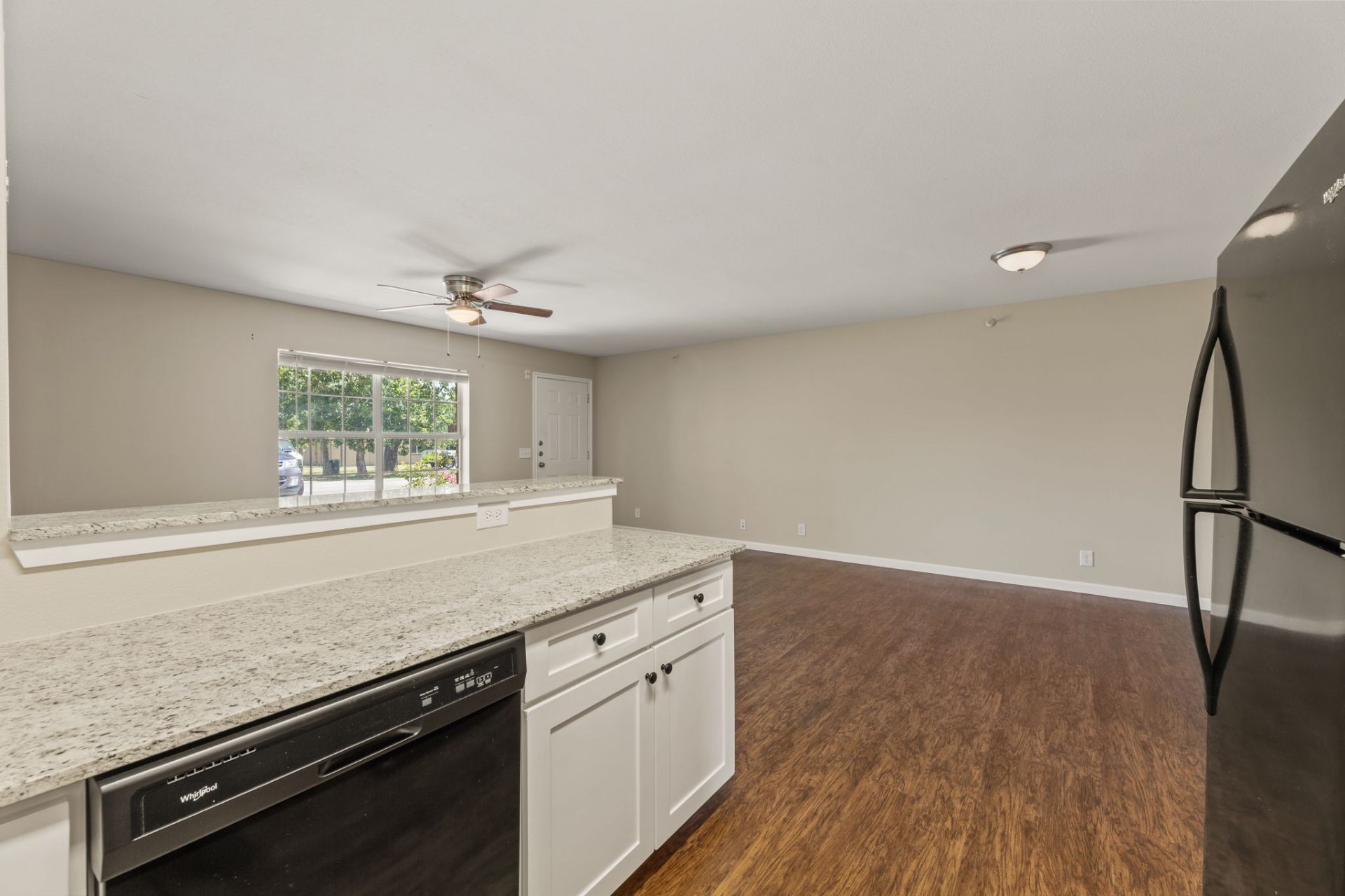 Kitchen breakfast bar opening to the living and dining area