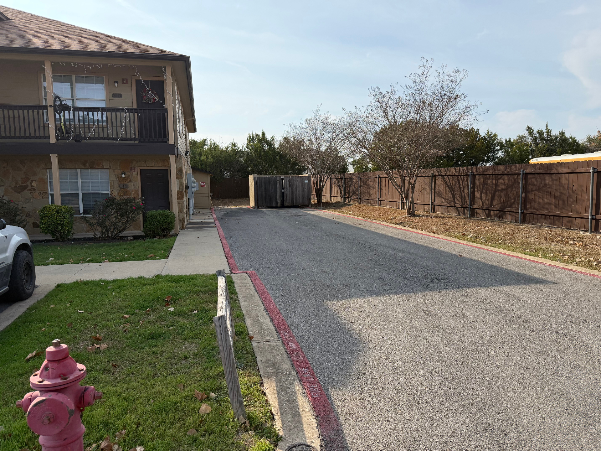 Rear drive aisle along the fenced edge of the property
